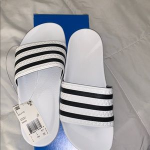 Adidas adilette slides.